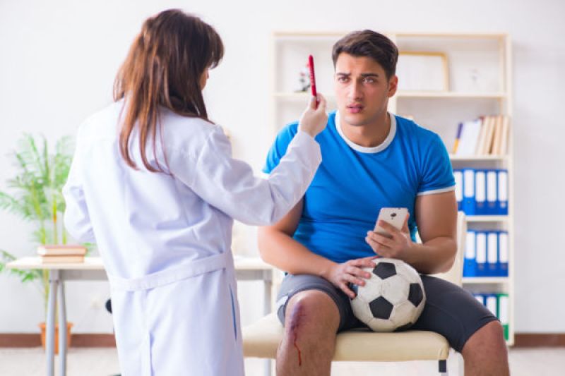 doctor performing a sports physical