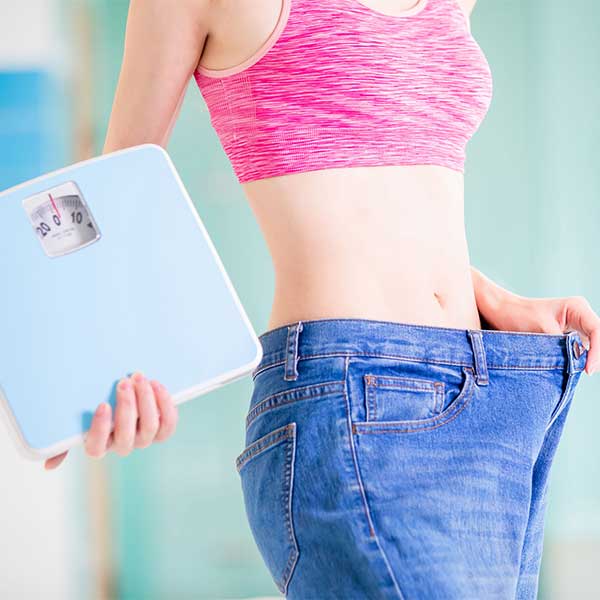 Woman holding a scale.