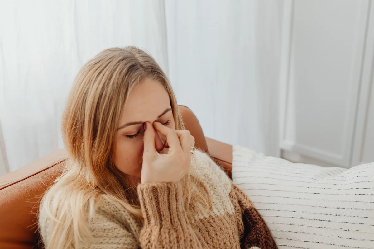 A woman needing sinus pressure releif.