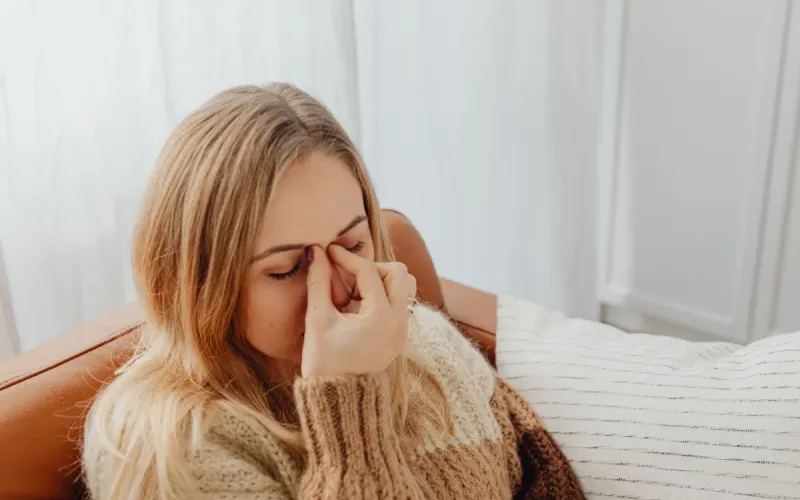 A woman needing sinus pressure releif.